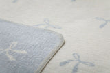 David Fussennegger | Juwel Baby Blanket | Blue Bows Allover